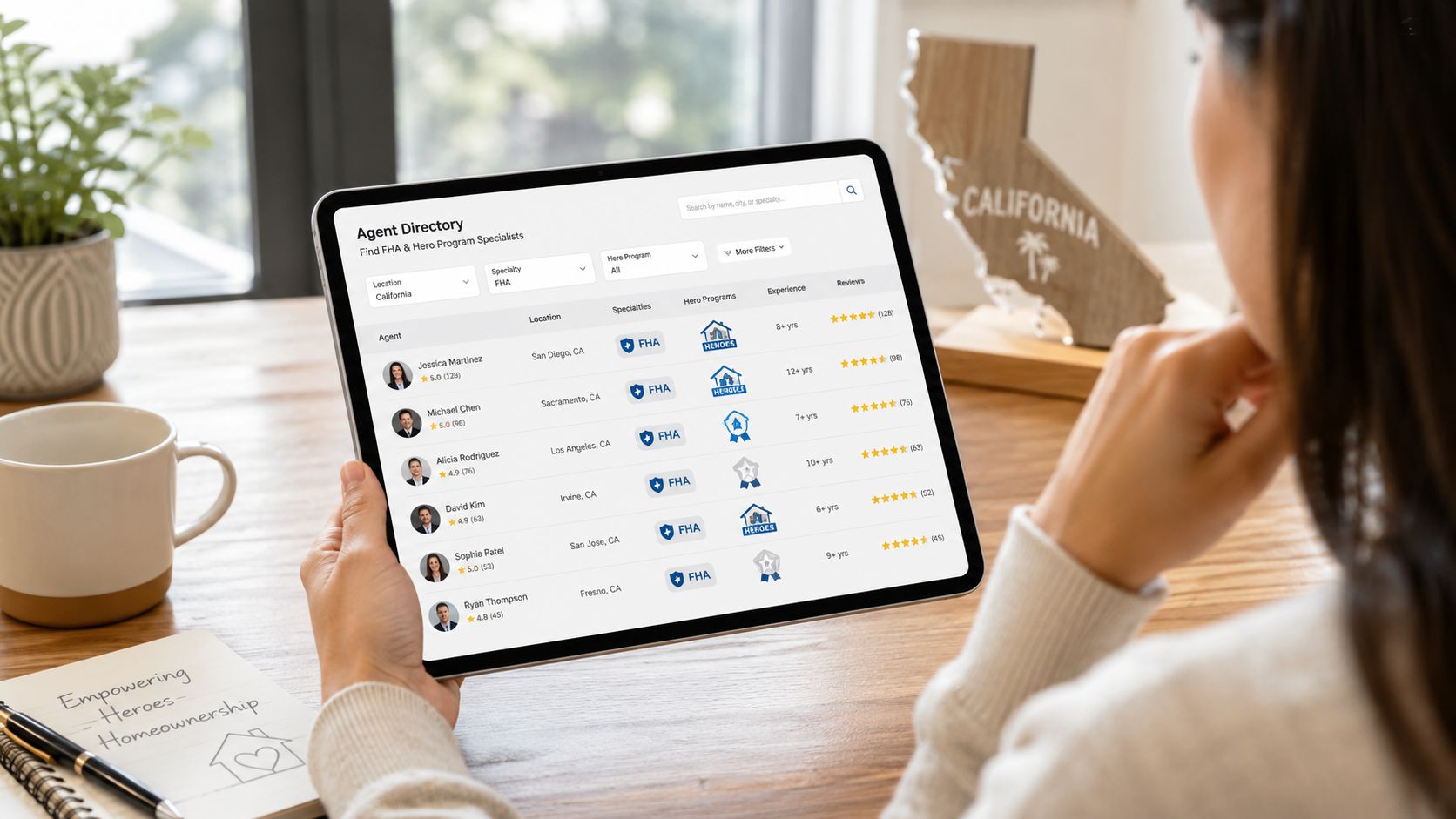 A person browsing an online agent directory for FHA loan specialists in California on a tablet.